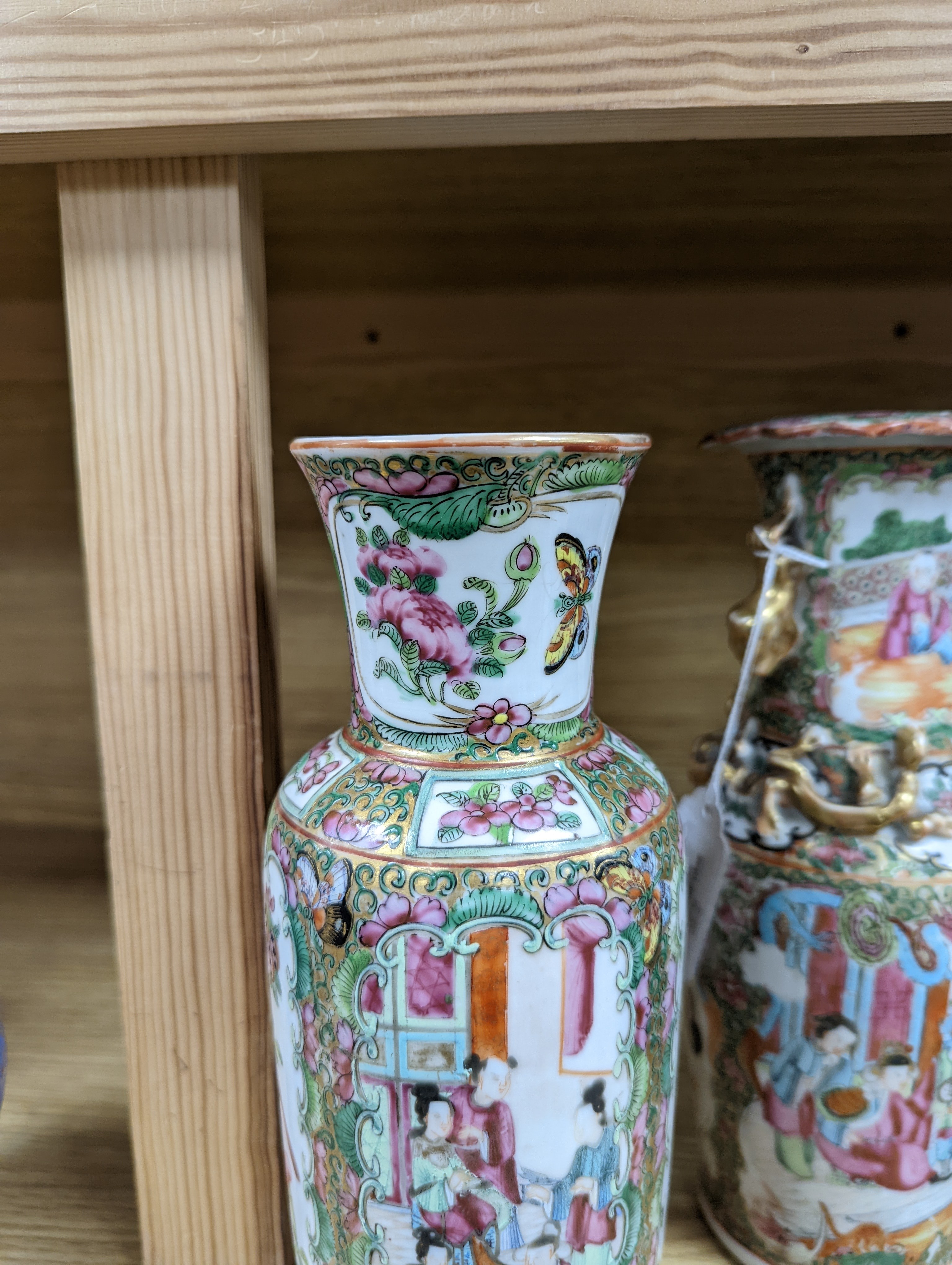 Two Chinese famille rose vases, late 19th century, tallest 26 cm, one wood stand, some restoration